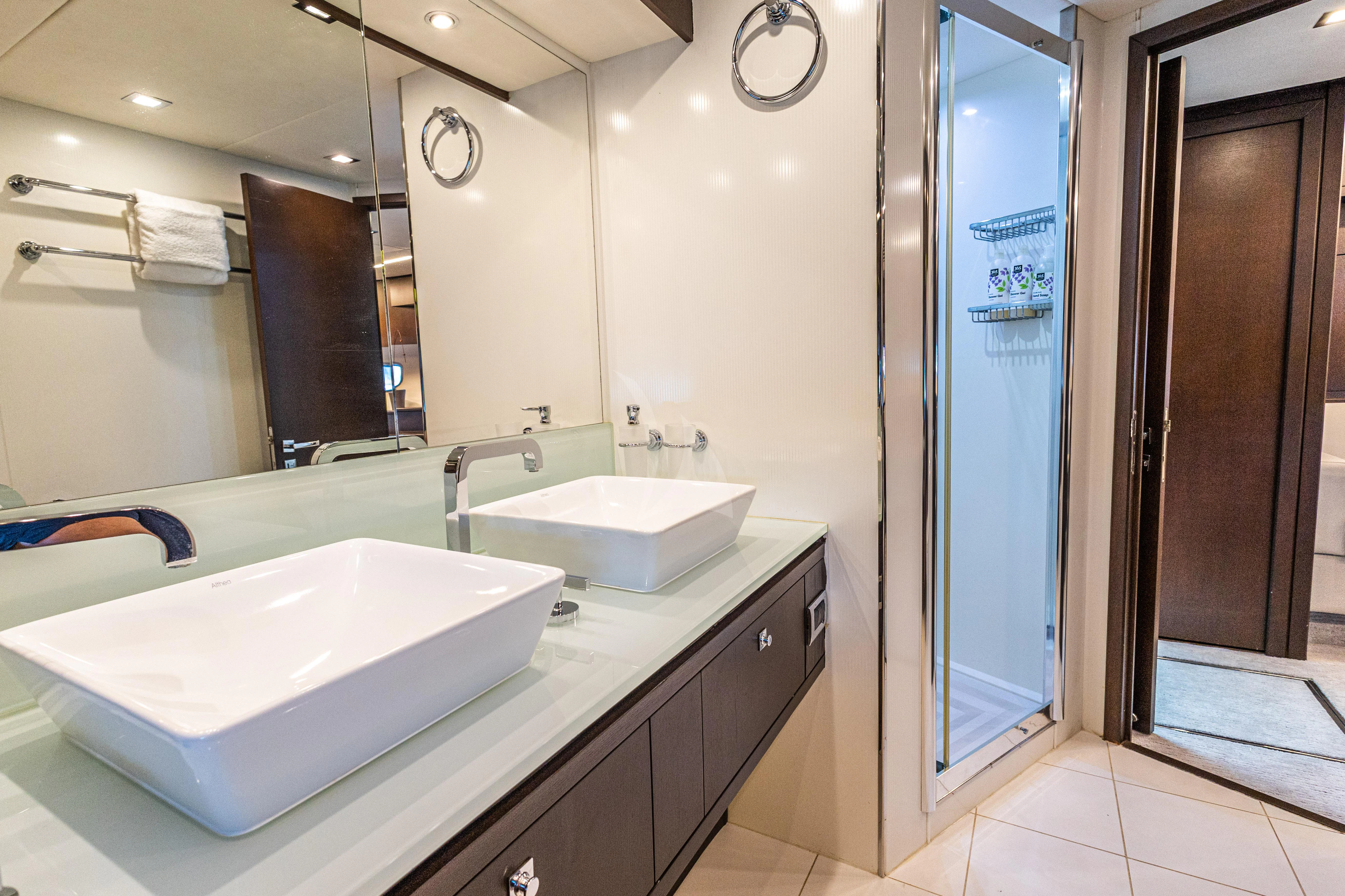 a bathroom with a large mirror aboard MOZZ II Yacht for Sale