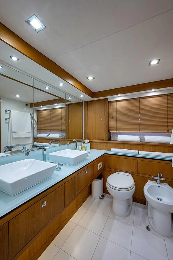 a bathroom with a large mirror aboard MOZZ II Yacht for Sale