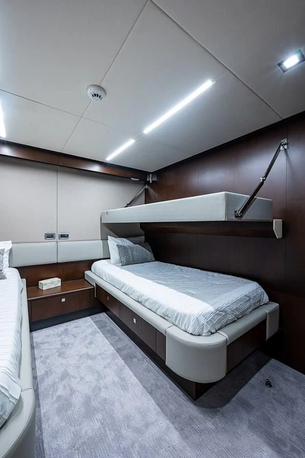 a bed in a room aboard MOZZ II Yacht for Sale