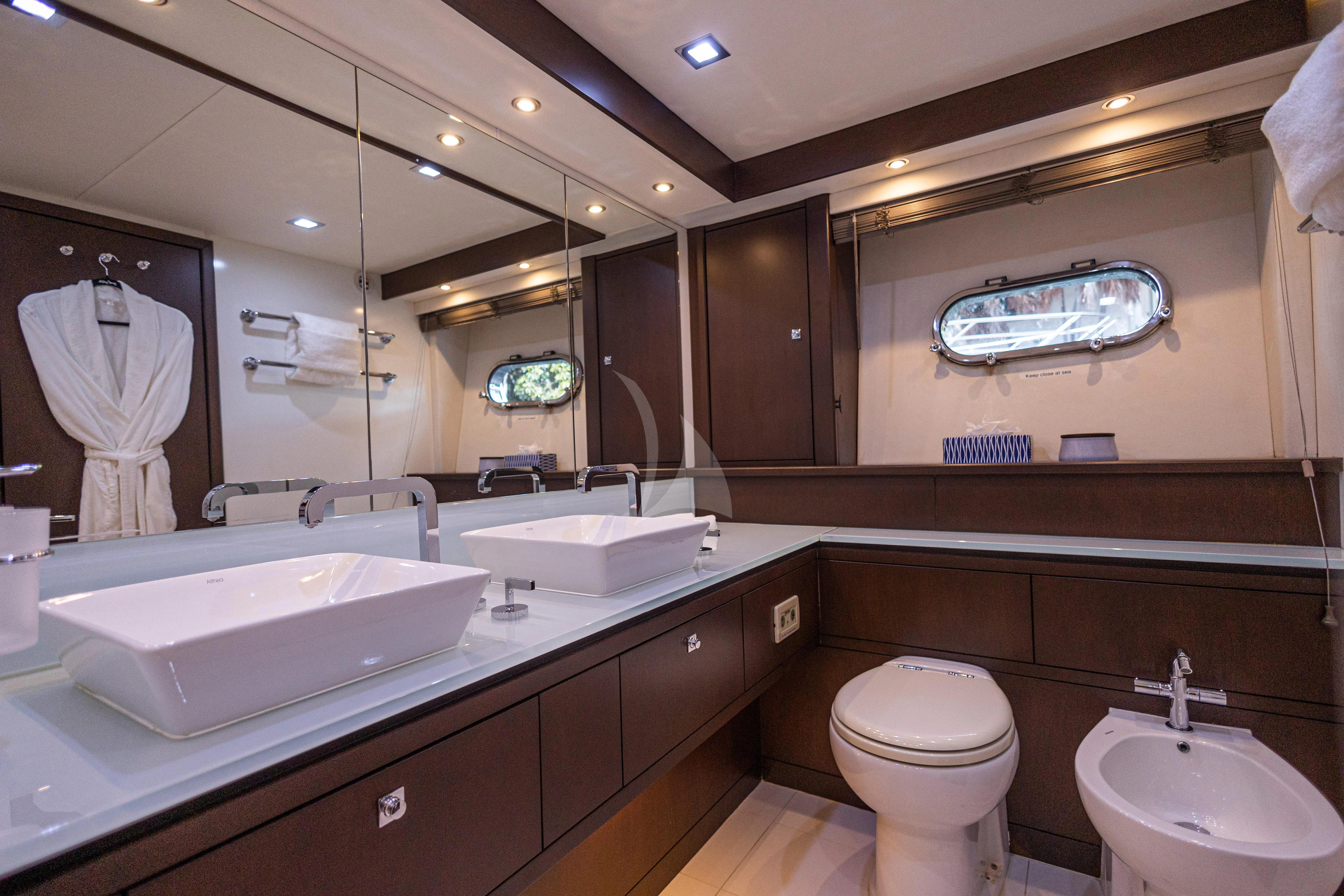 a bathroom with a large mirror aboard MOZZ II Yacht for Sale