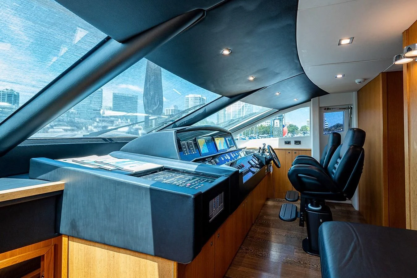 a room with a large window and a desk with a computer on it aboard MOZZ II Yacht for Sale