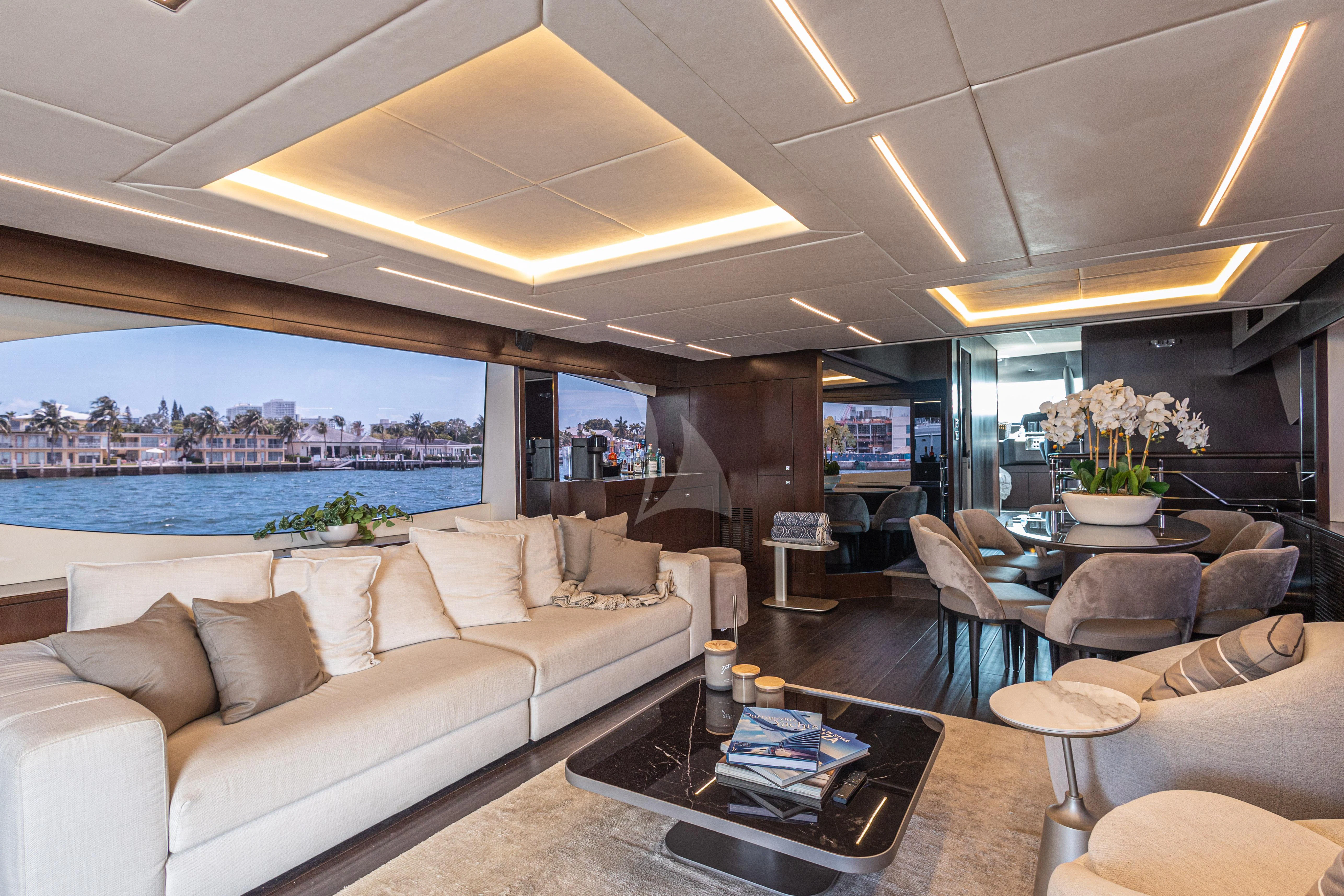 a living room with a large window aboard MOZZ II Yacht for Sale