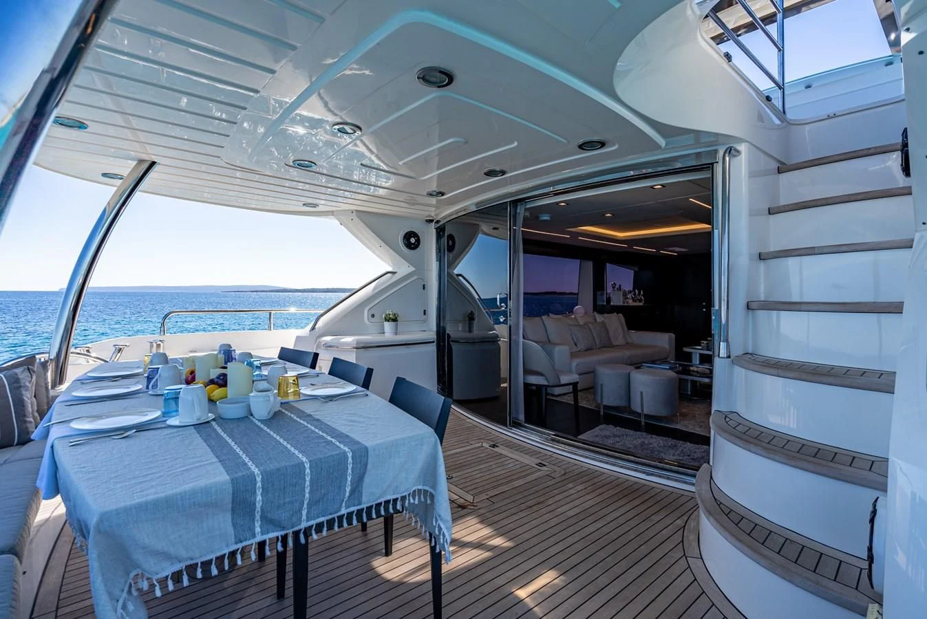 a boat with a table and chairs aboard MOZZ II Yacht for Sale