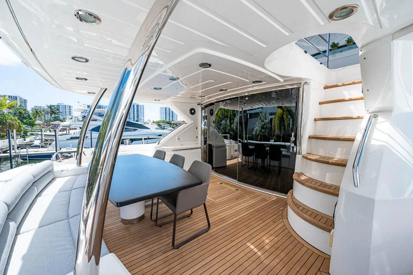 a room with a table and chairs aboard MOZZ II Yacht for Sale