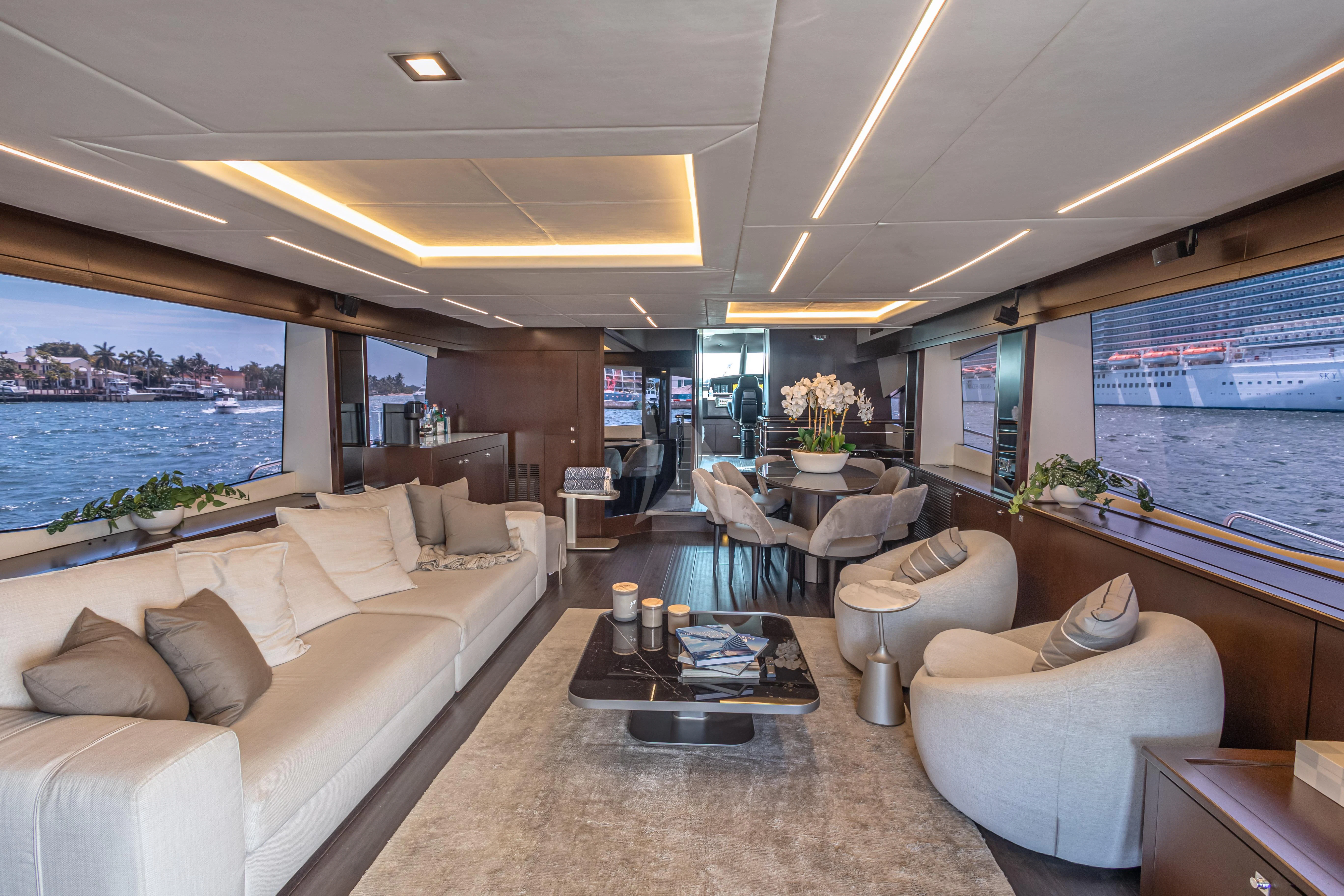 a living room with a large window aboard MOZZ II Yacht for Sale