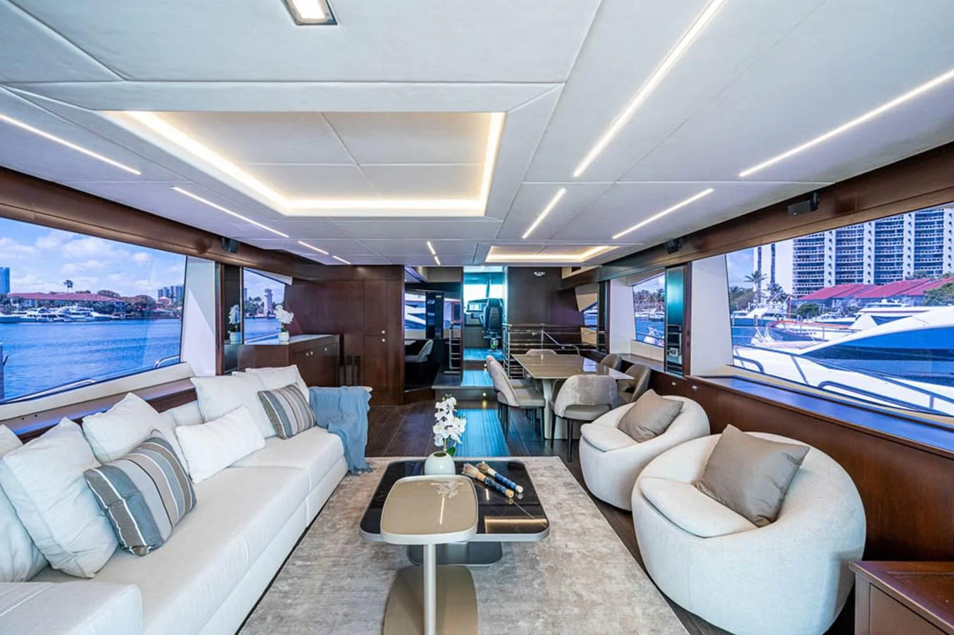 a living room with a large window aboard MOZZ II Yacht for Sale