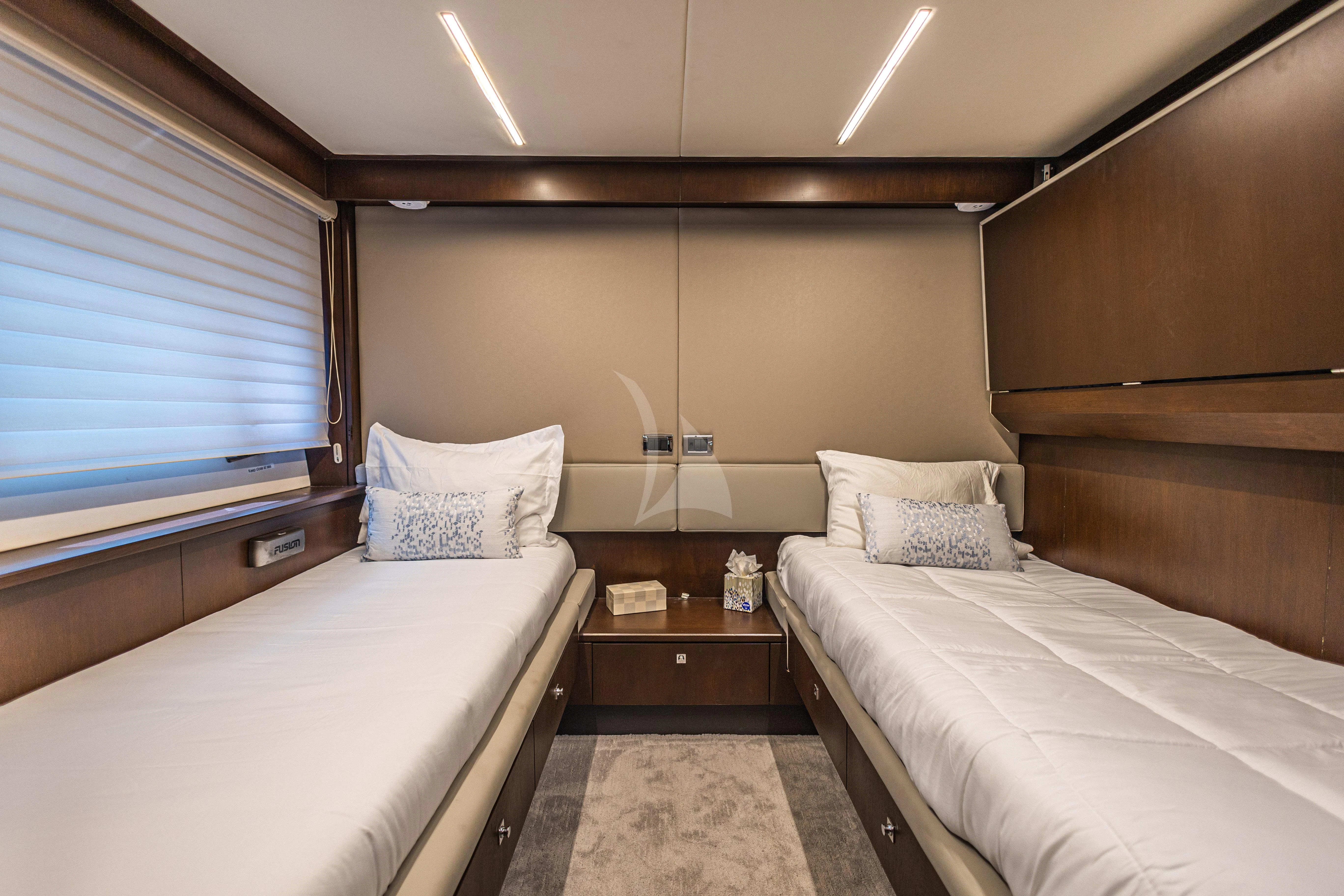 a couple of beds in a room aboard MOZZ II Yacht for Sale