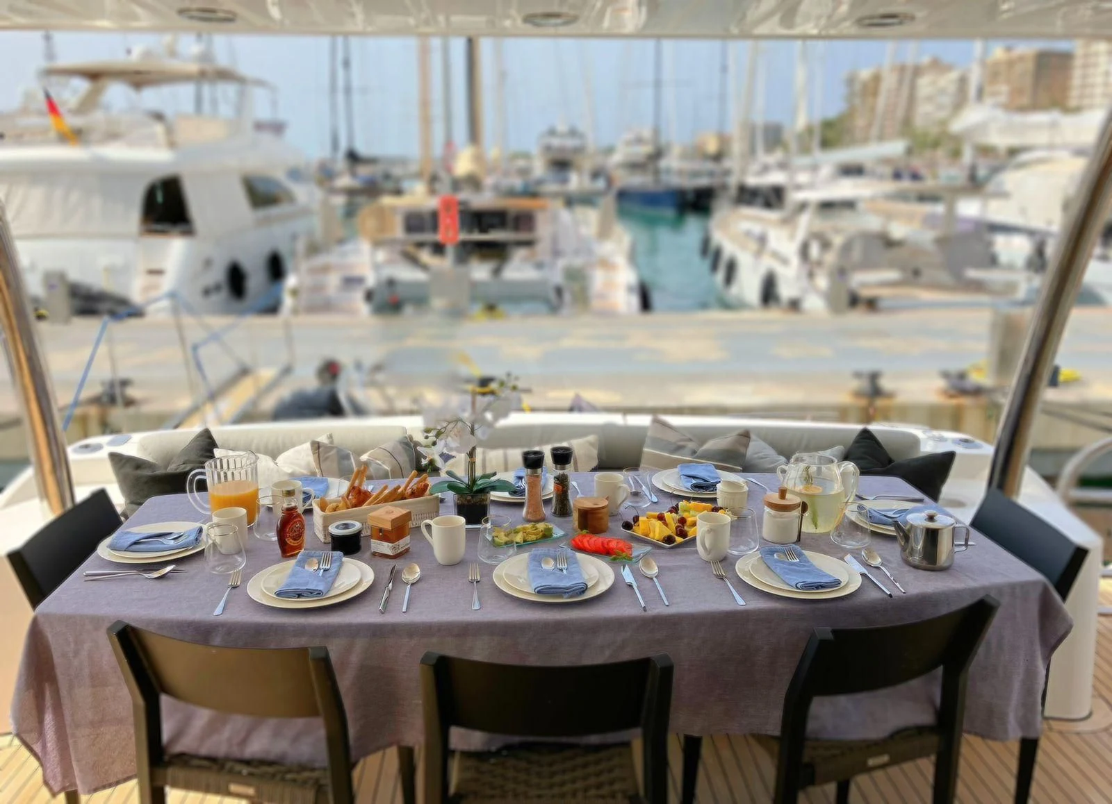 a table set for a meal on a balcony aboard MOZZ II Yacht for Sale