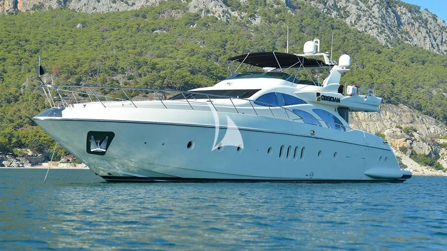 a white yacht on the water aboard OBSIDIAN Yacht for Sale