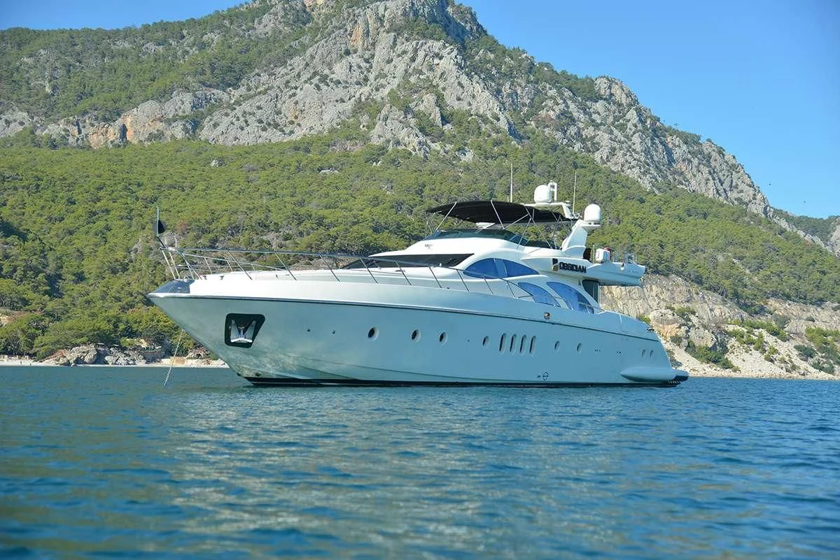 a white yacht on the water aboard OBSIDIAN Yacht for Sale