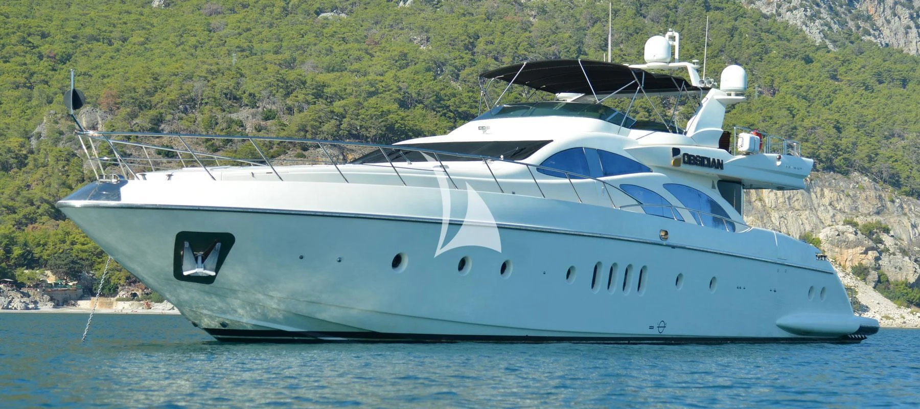a white yacht in the water aboard OBSIDIAN Yacht for Sale