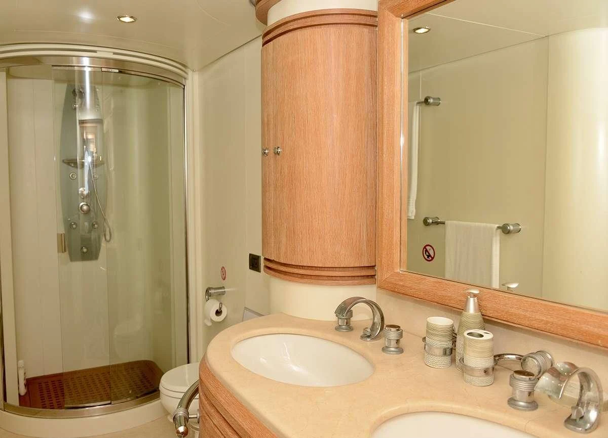 a bathroom with a shower and sink aboard OBSIDIAN Yacht for Sale