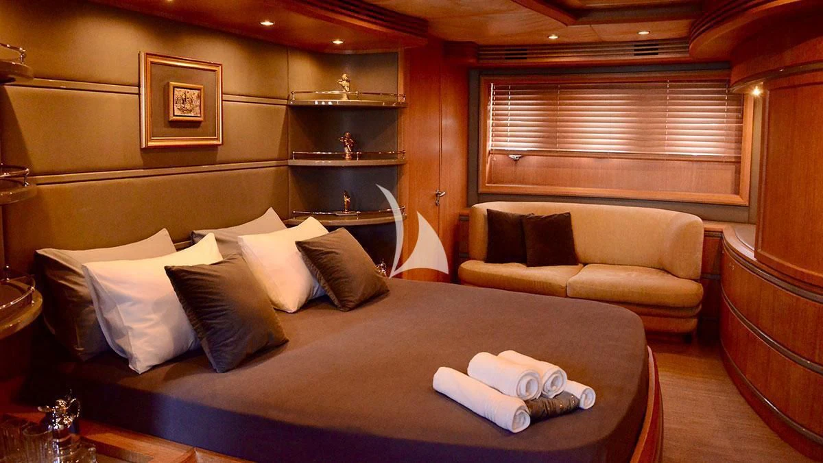 a bed with pillows and pillows aboard OBSIDIAN Yacht for Sale