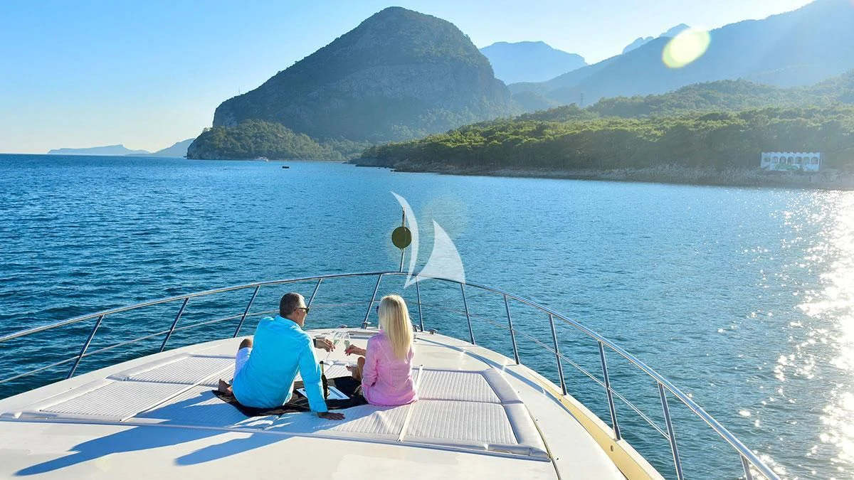 a man and a woman on a boat in the water aboard OBSIDIAN Yacht for Sale
