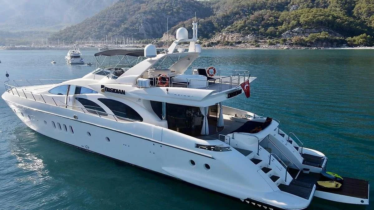 a white yacht in the water aboard OBSIDIAN Yacht for Sale