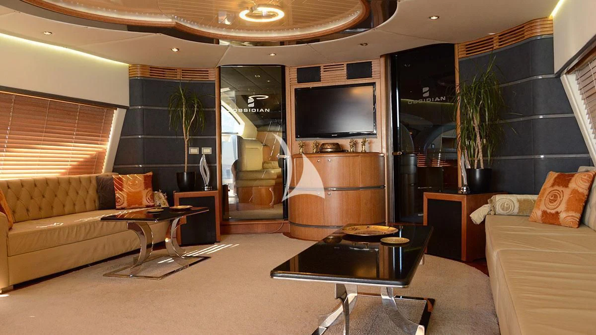 a living room with a fireplace aboard OBSIDIAN Yacht for Sale