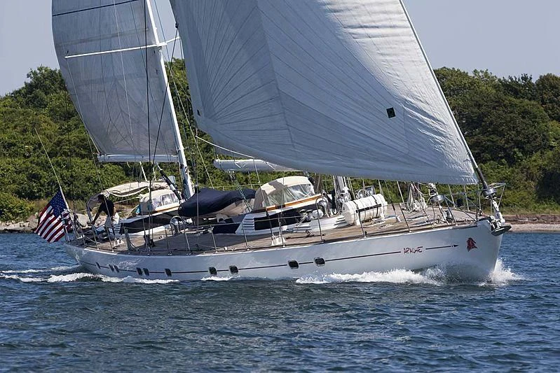 a boat with a flag on it aboard APACHE Yacht for Sale