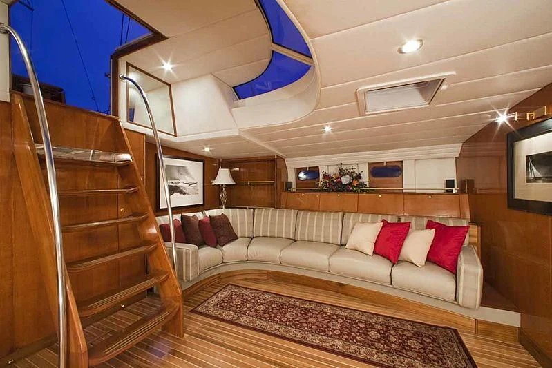 a living room with a large bed aboard APACHE Yacht for Sale