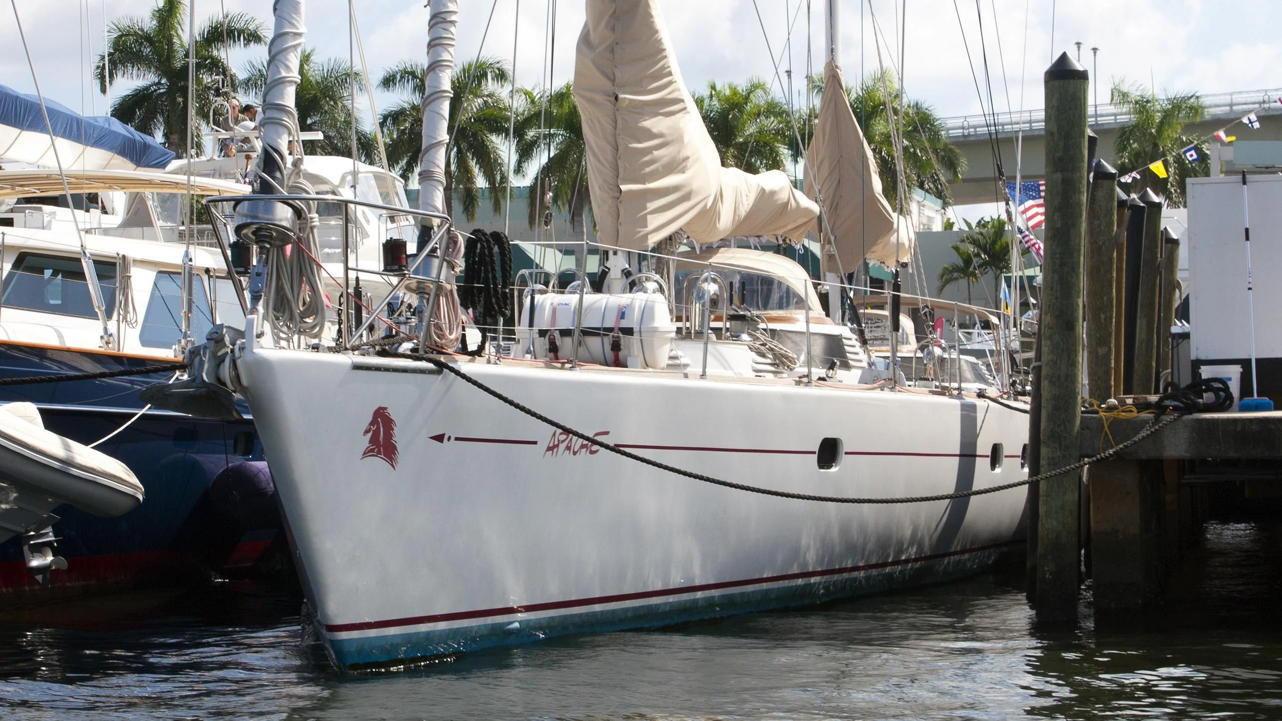 a group of boats are parked in a harbor aboard APACHE Yacht for Sale