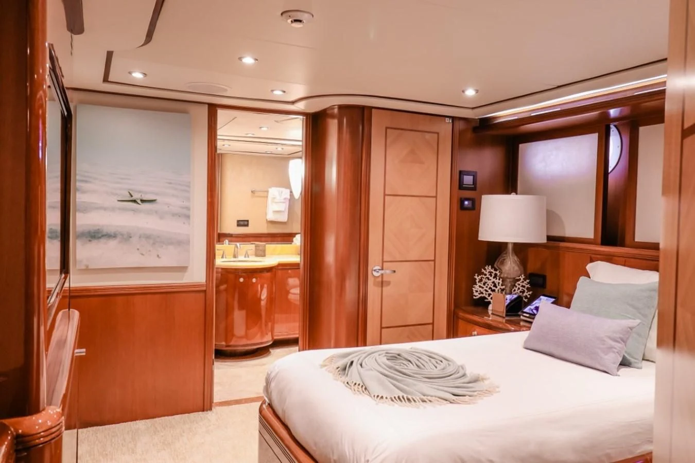 a bedroom with a bed and a desk aboard JUST ENOUGH Yacht for Charter