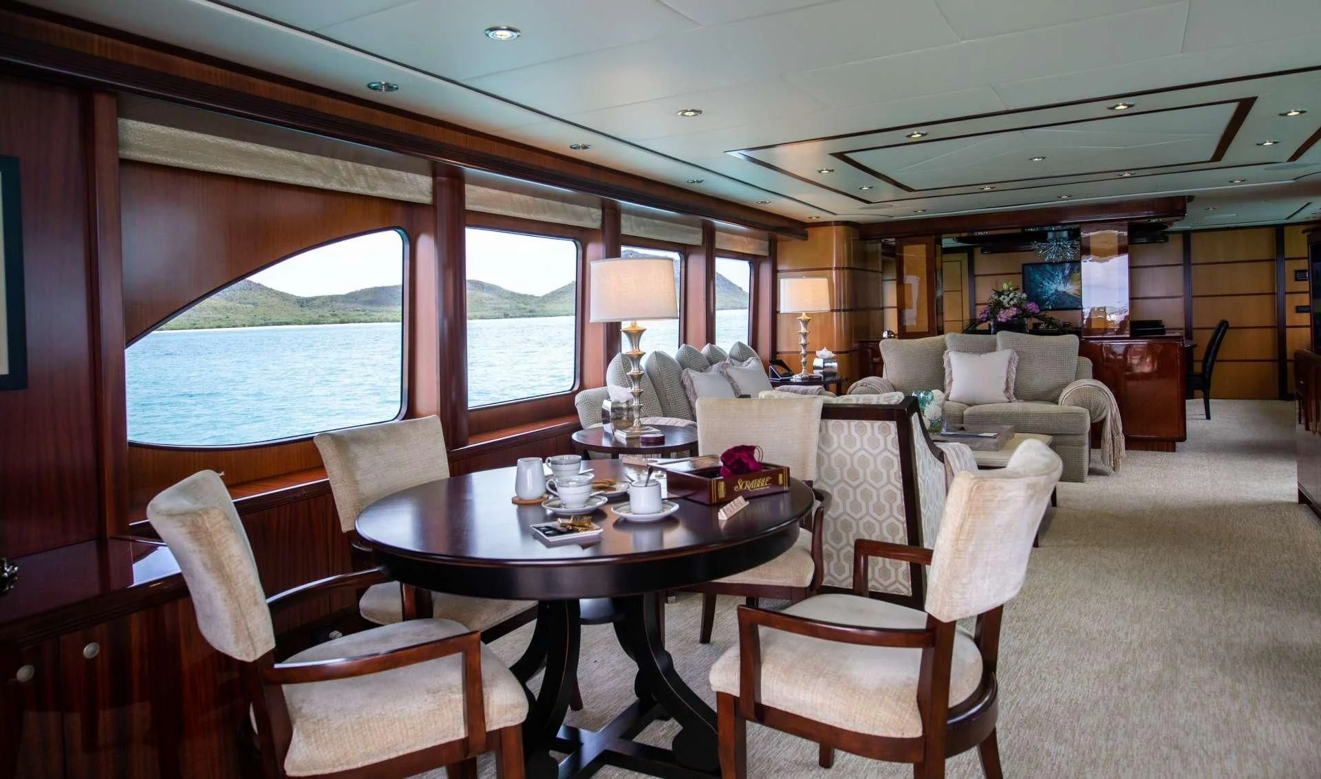 a dining room with a table and chairs aboard JUST ENOUGH Yacht for Charter