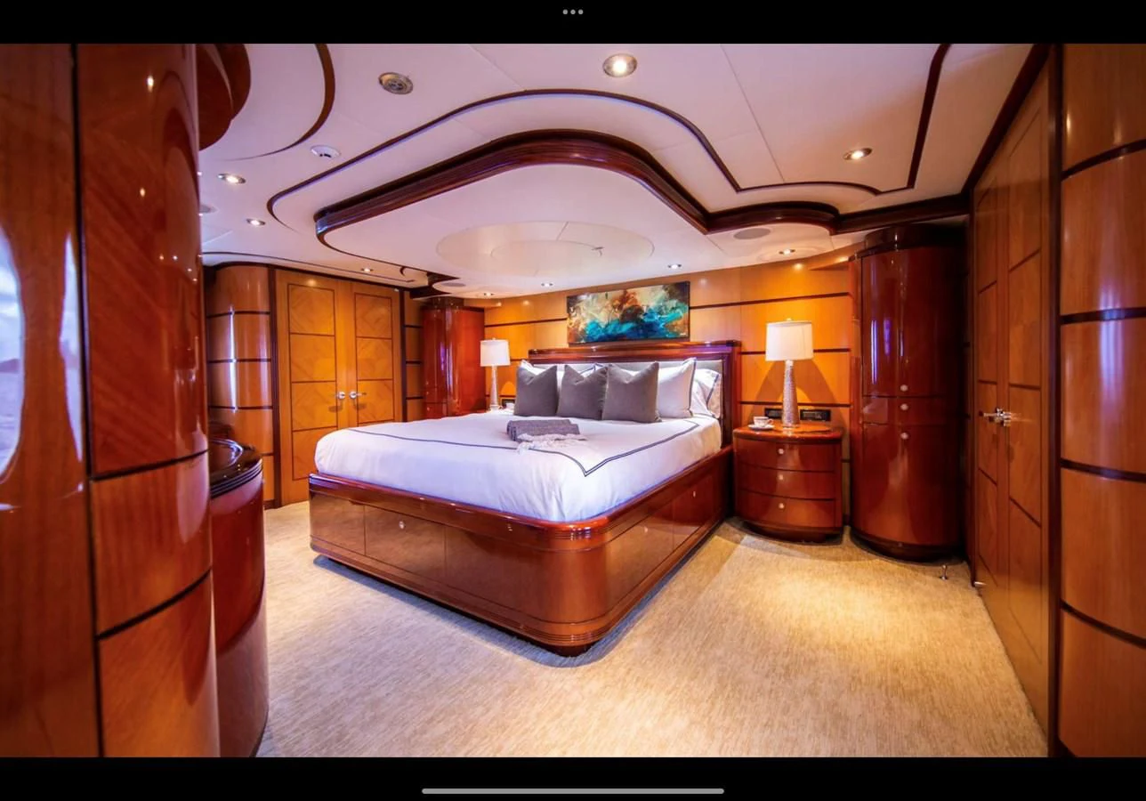 a bedroom with a large bed aboard JUST ENOUGH Yacht for Charter
