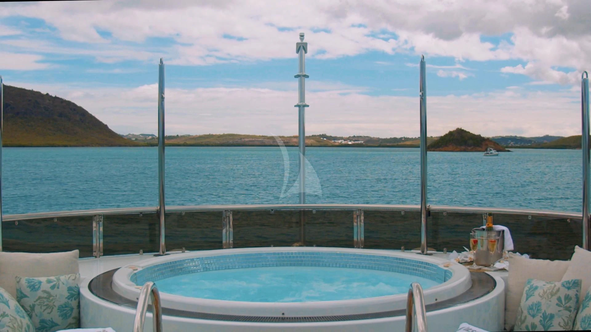 a pool with water in the background aboard JUST ENOUGH Yacht for Charter