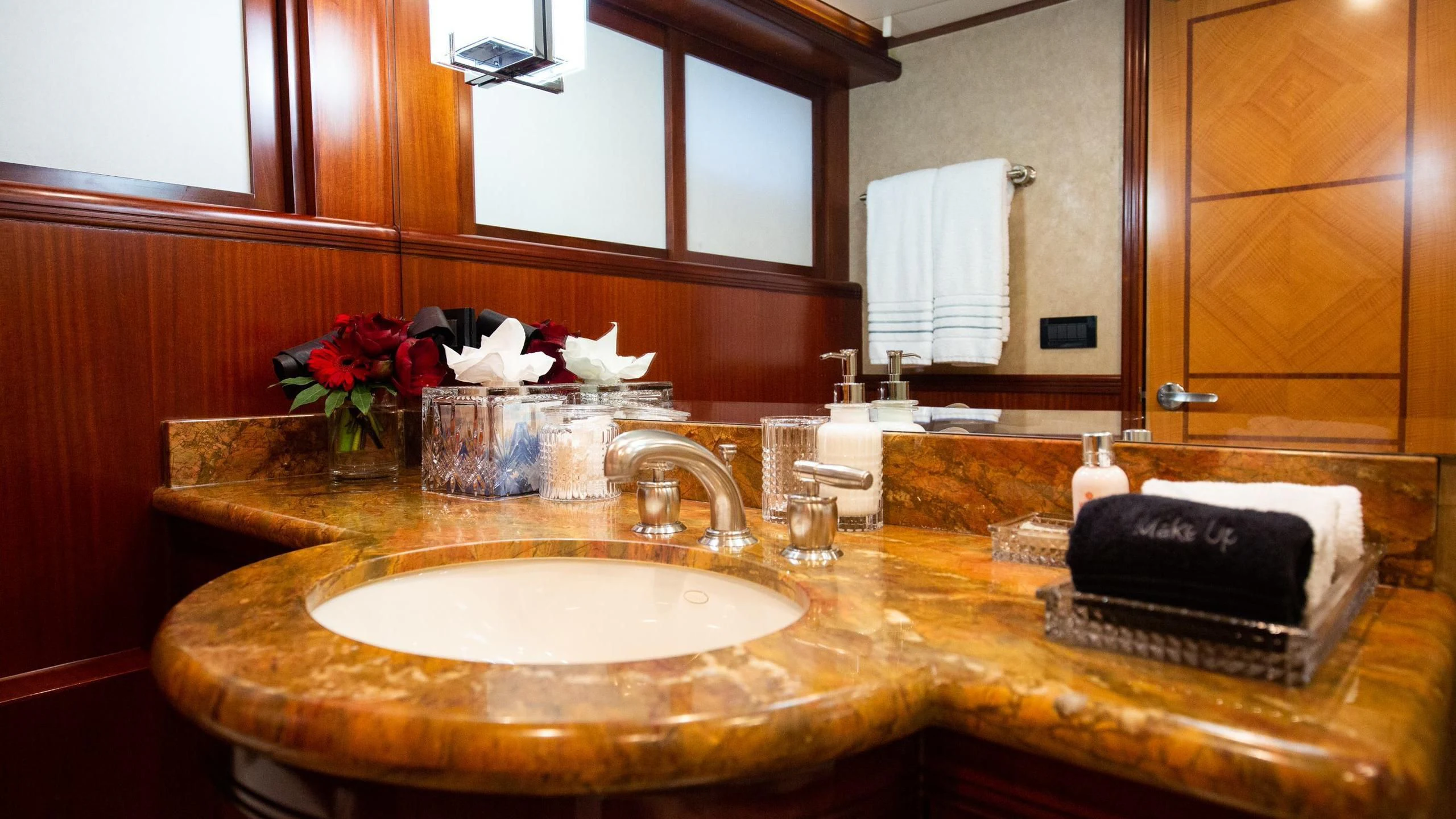 a bathroom with a sink and a mirror aboard JUST ENOUGH Yacht for Charter