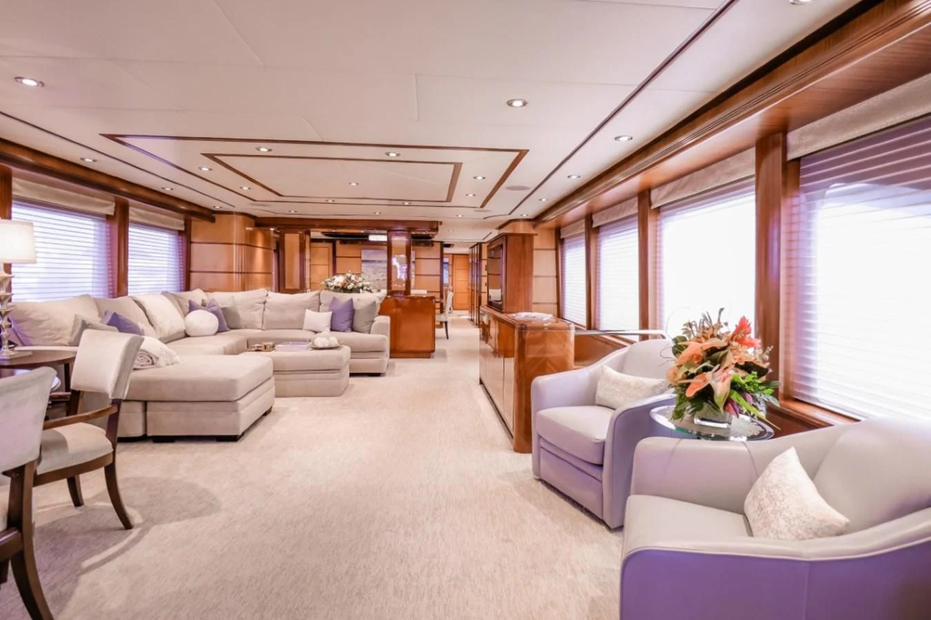 a living room with a couch and a table aboard JUST ENOUGH Yacht for Charter