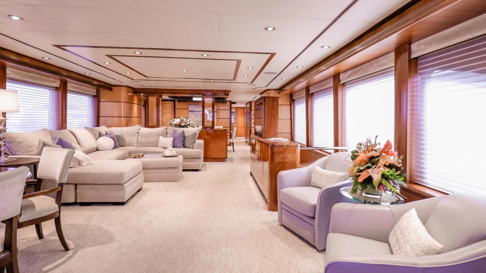 a living room with a couch and a table aboard JUST ENOUGH Yacht for Charter