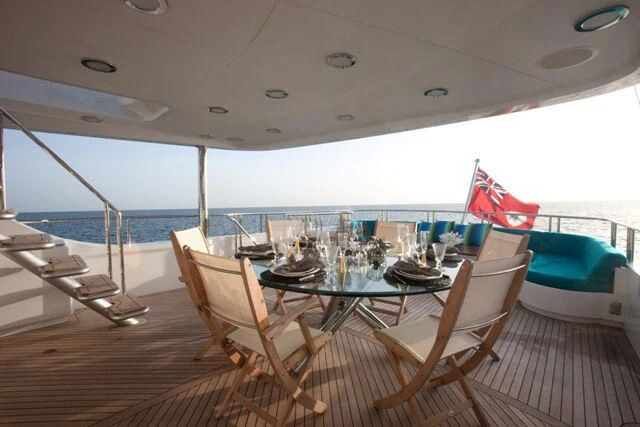 a table set for a meal on a boat aboard JUST ENOUGH Yacht for Charter