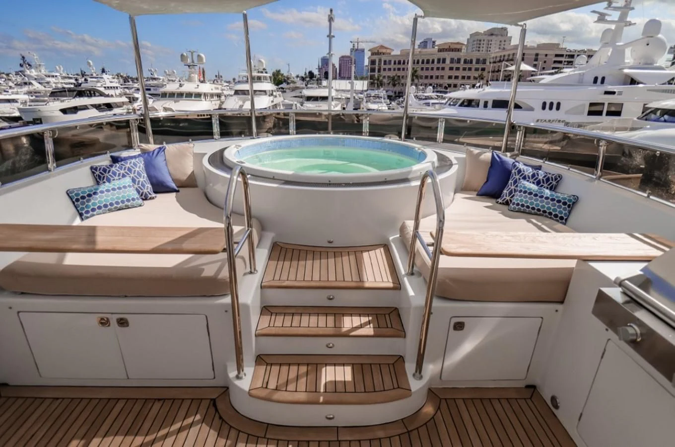 a deck overlooking a marina aboard JUST ENOUGH Yacht for Charter