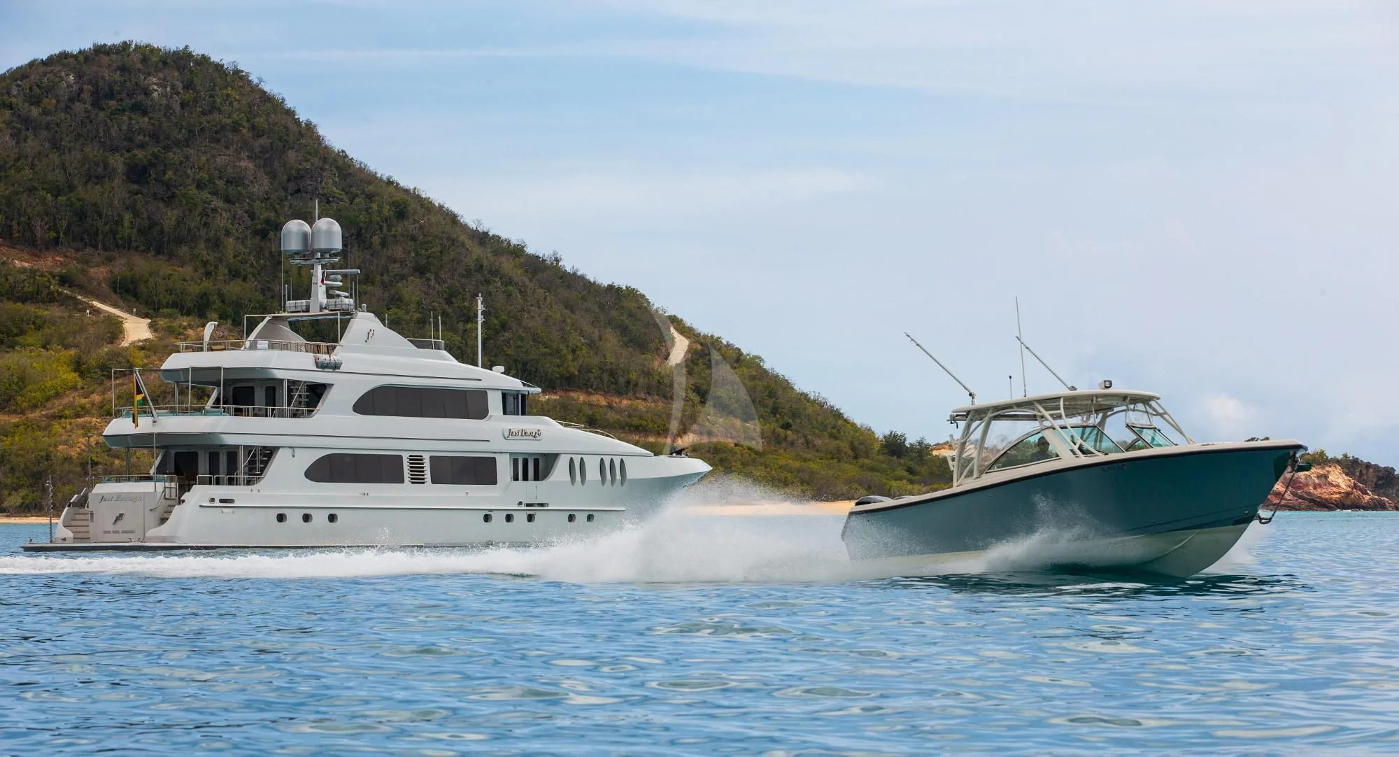 a couple of boats in the water aboard JUST ENOUGH Yacht for Charter