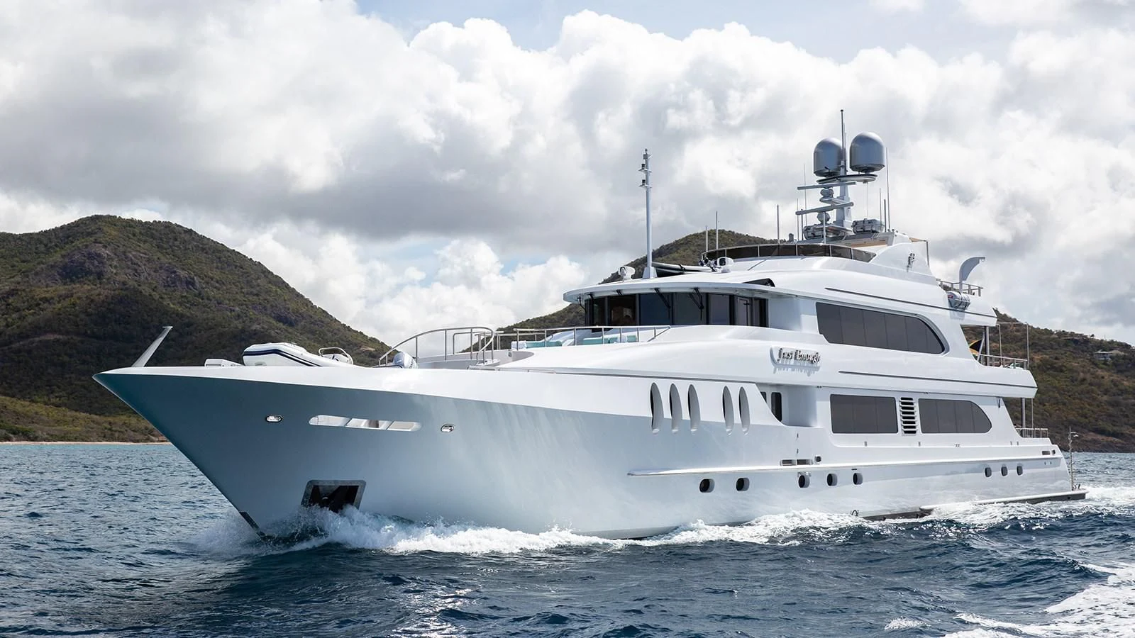 a white boat in the water aboard JUST ENOUGH Yacht for Charter