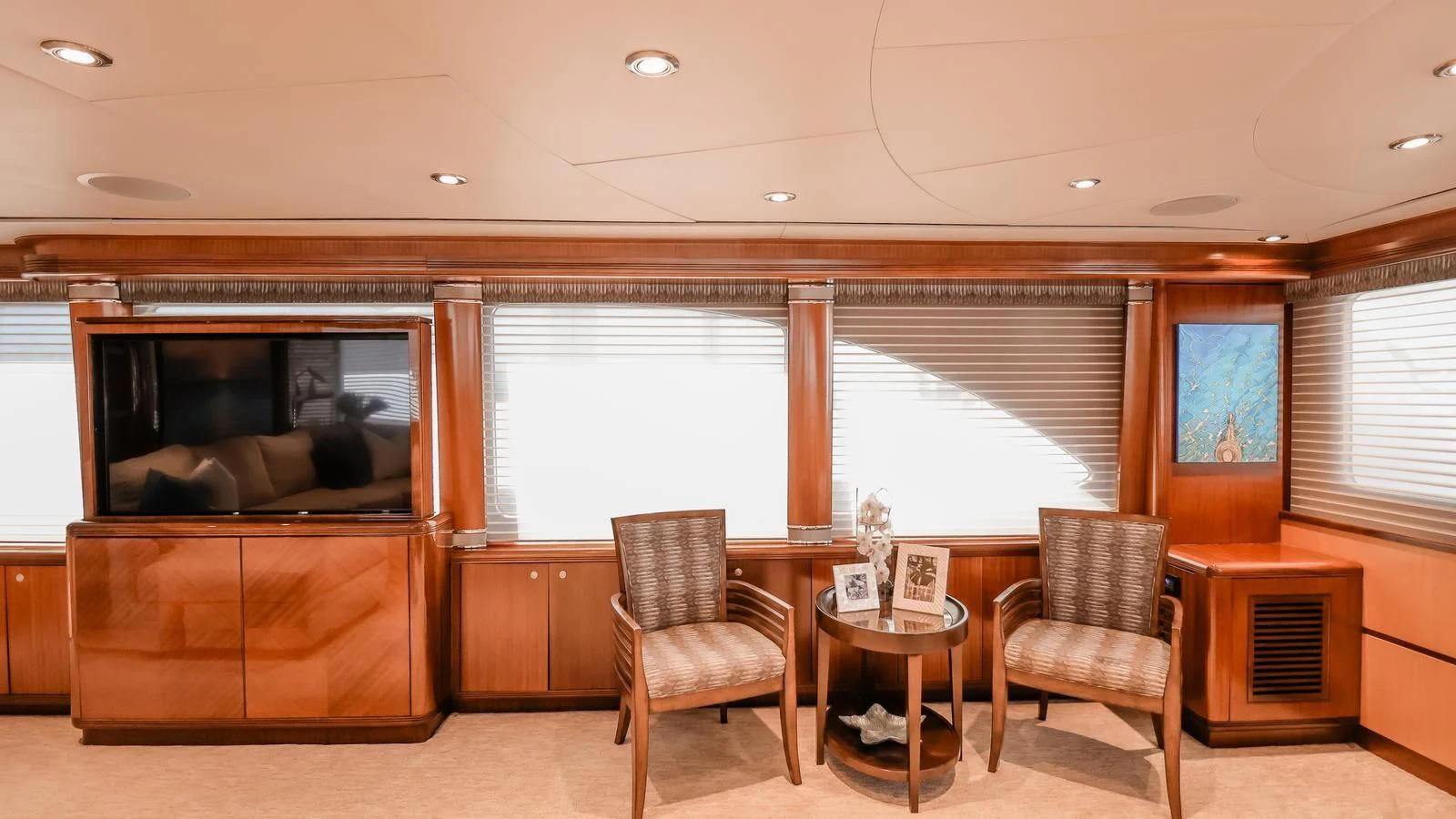 a living room with a fireplace aboard JUST ENOUGH Yacht for Charter