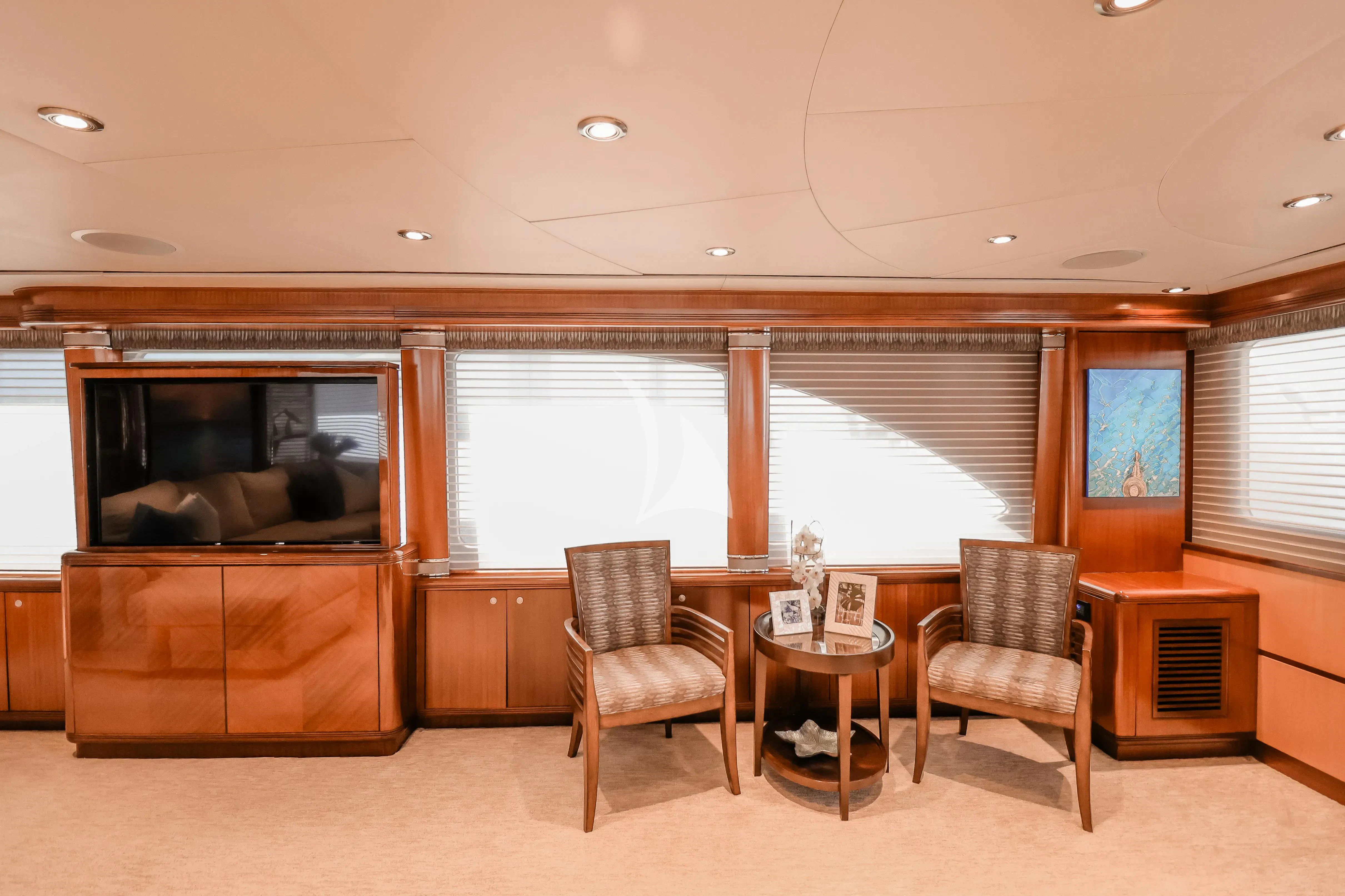 a living room with a fireplace aboard JUST ENOUGH Yacht for Charter