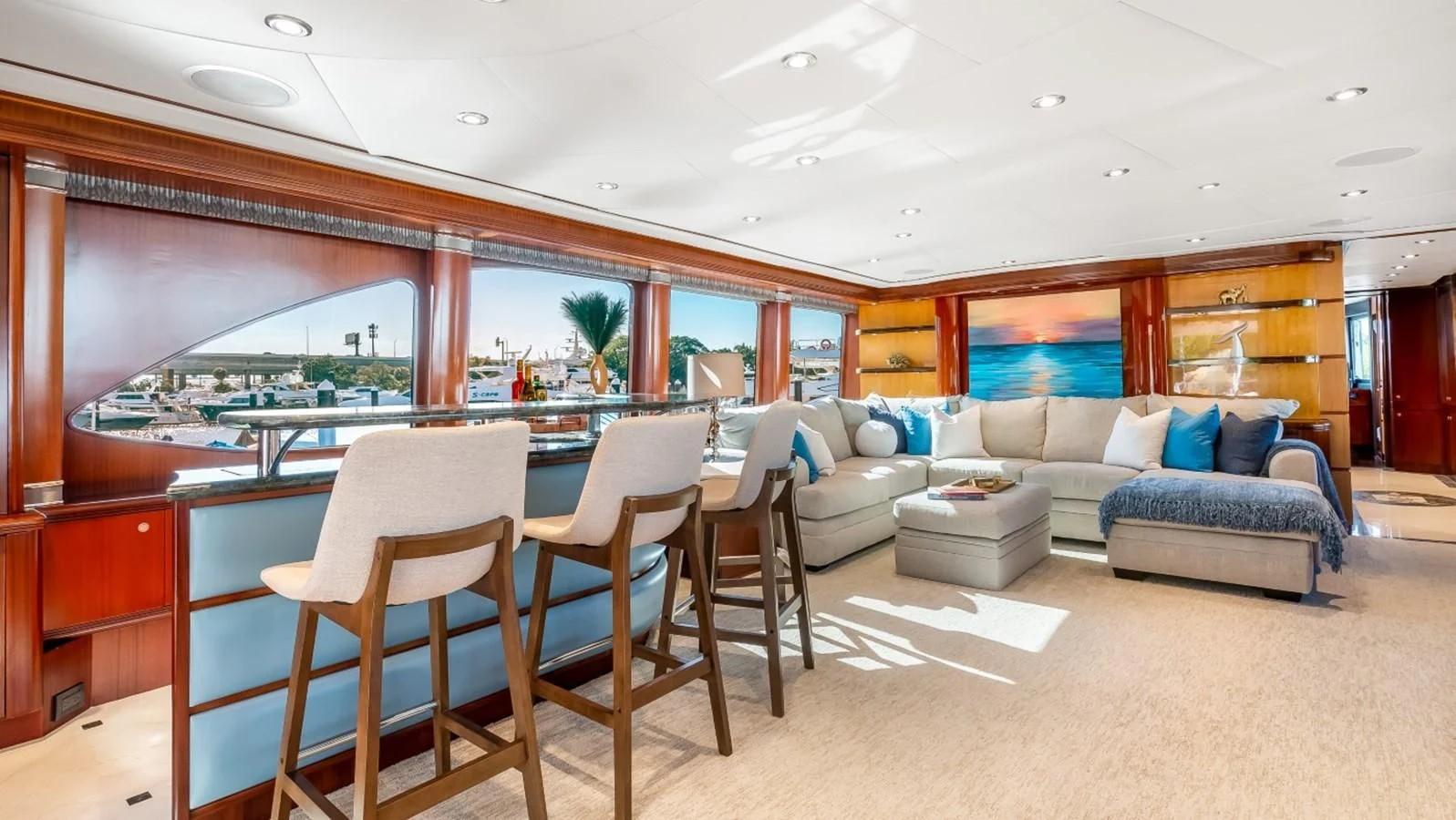 a large living room with a large table and chairs aboard JUST ENOUGH Yacht for Charter