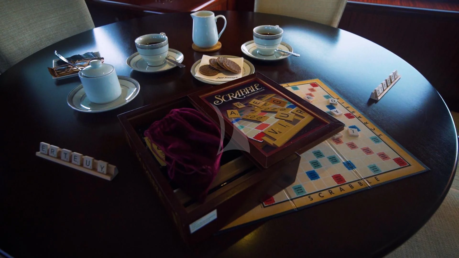 a table with a game board and cups on it aboard JUST ENOUGH Yacht for Charter