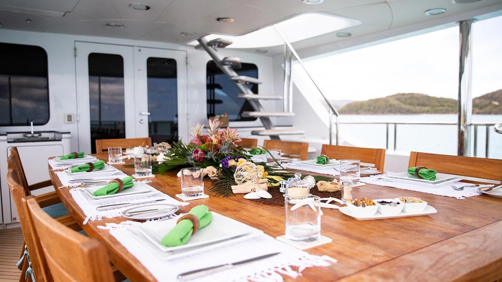 a table with food and drinks on it aboard JUST ENOUGH Yacht for Charter