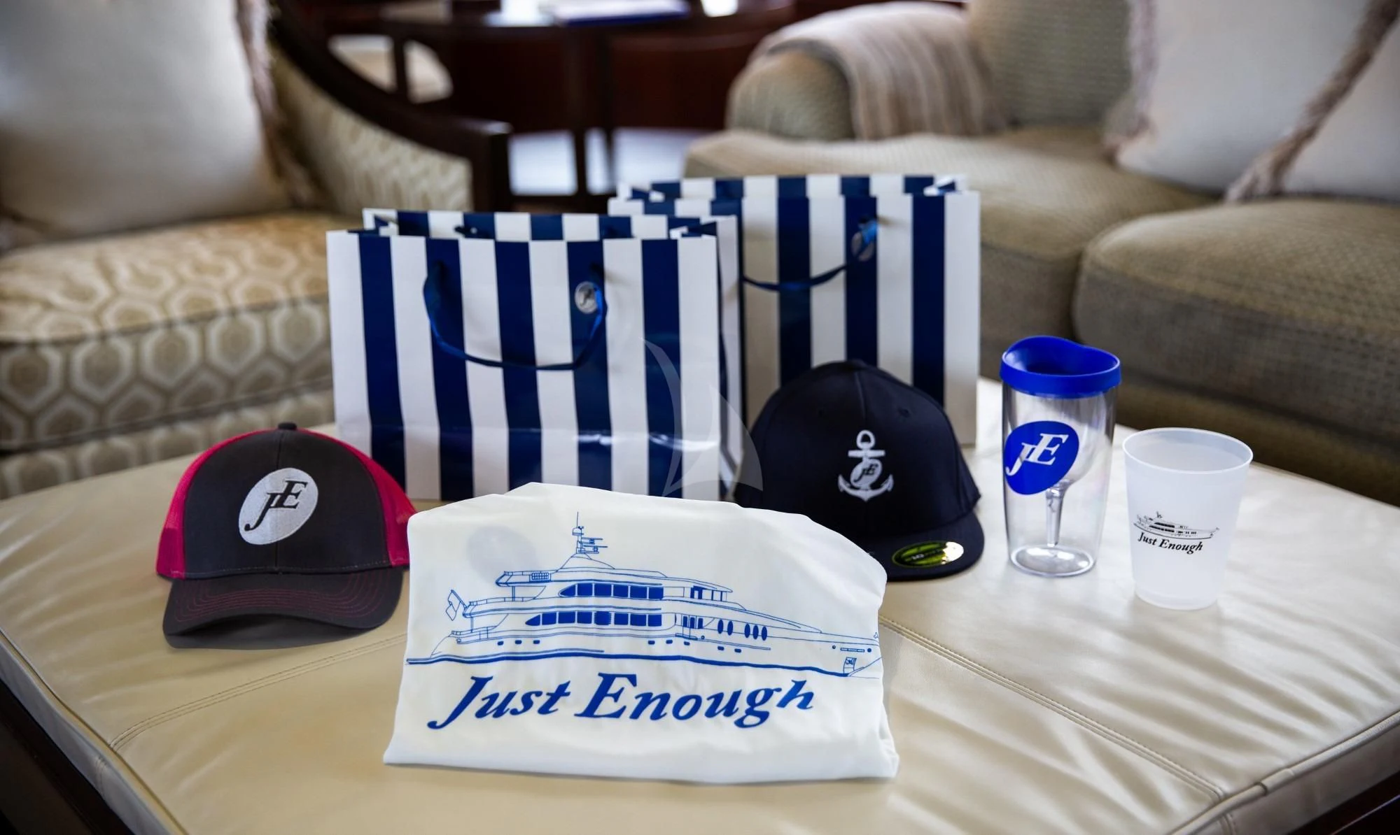 a table with a hat and a book on it aboard JUST ENOUGH Yacht for Charter