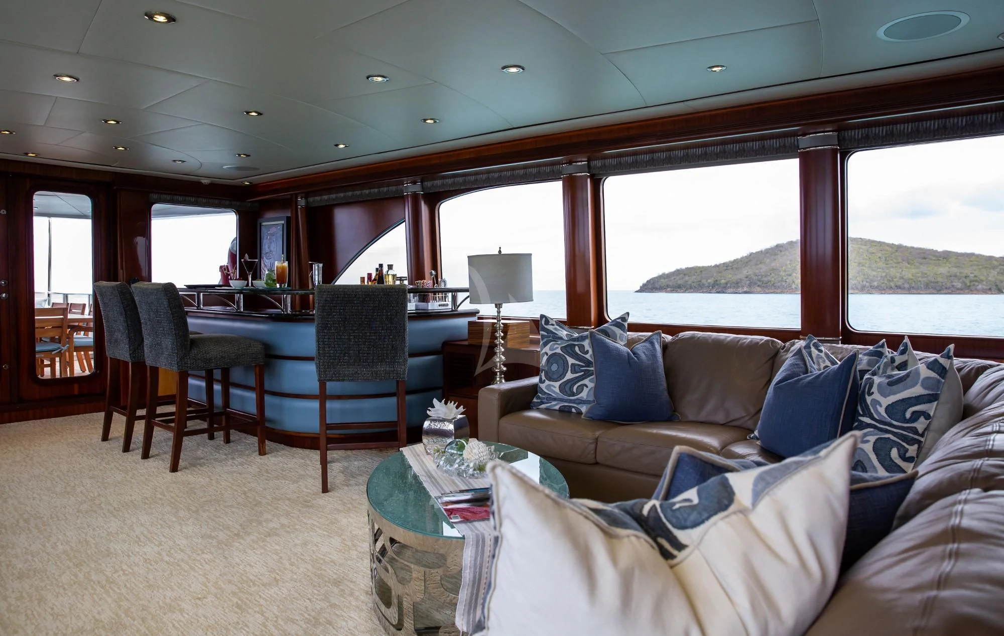 a living room with a large window aboard JUST ENOUGH Yacht for Charter