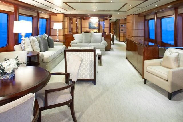 a living room with a couch and a table aboard JUST ENOUGH Yacht for Charter