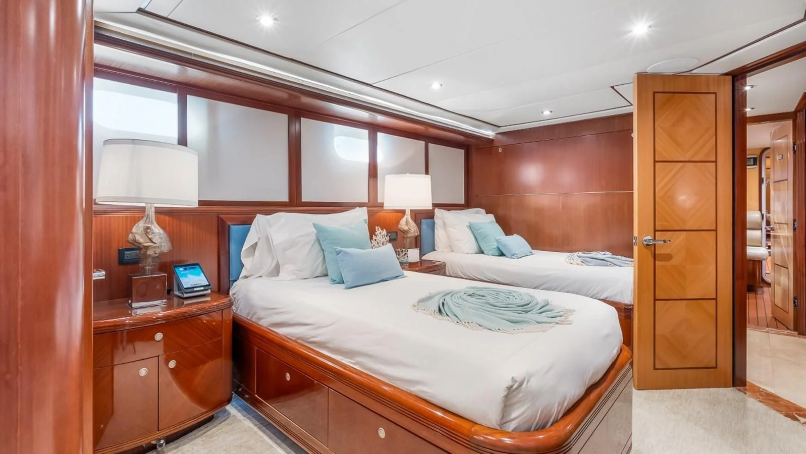 a hotel room with two beds aboard JUST ENOUGH Yacht for Charter