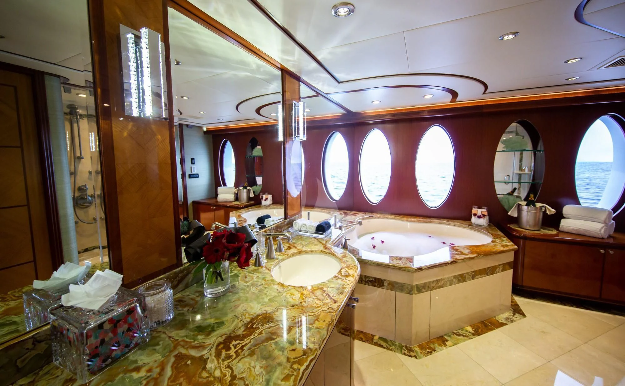 a bathroom with a large tub and sinks aboard JUST ENOUGH Yacht for Charter