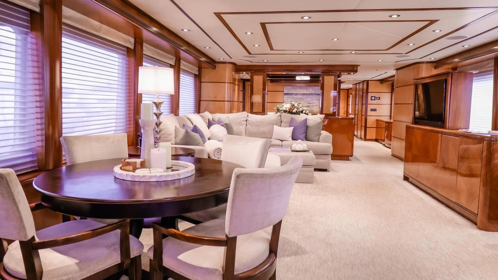 a living room with a table and chairs aboard JUST ENOUGH Yacht for Charter