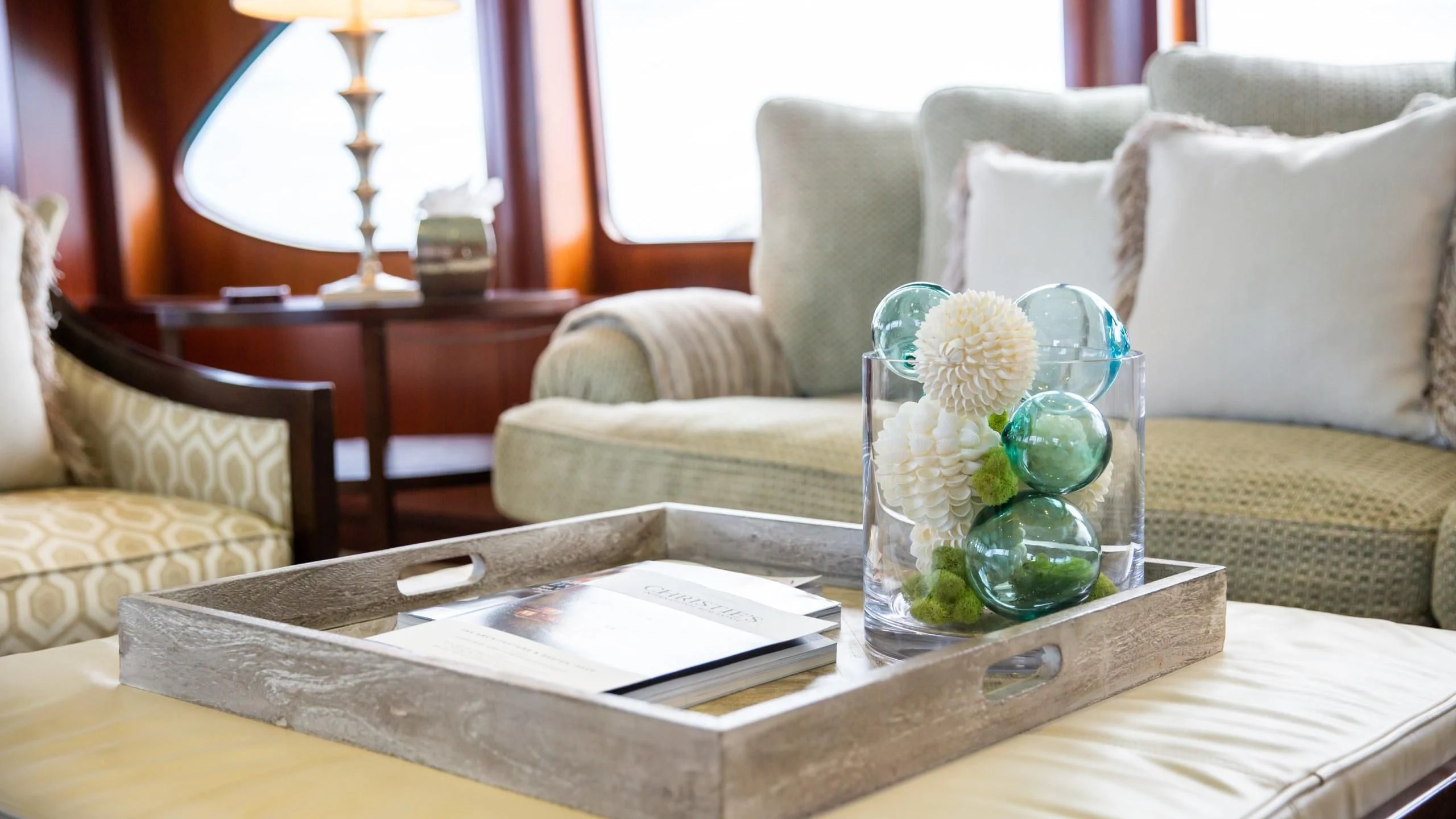 a glass vase with flowers on a table aboard JUST ENOUGH Yacht for Charter