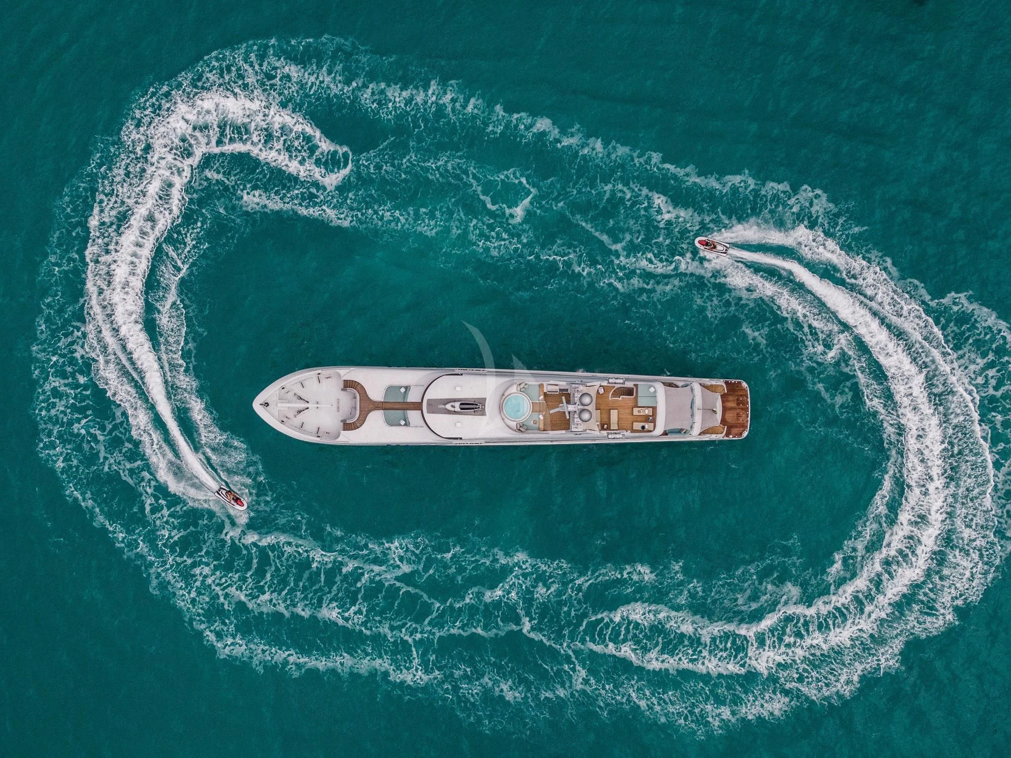 a small ship in the water aboard JUST ENOUGH Yacht for Charter