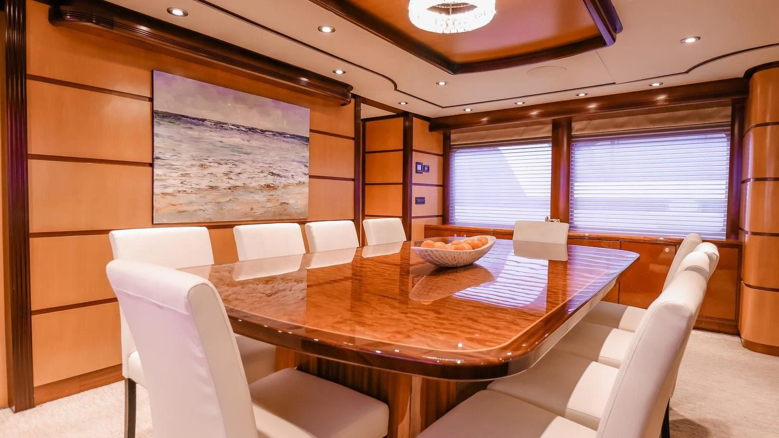 a room with a table chairs and a large window aboard JUST ENOUGH Yacht for Charter