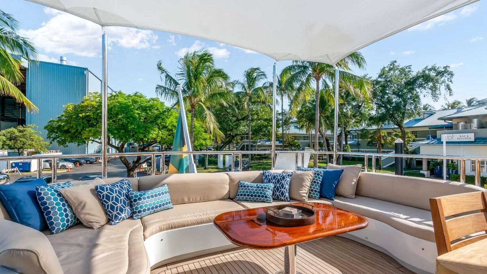 a large patio with a couch and a table and chairs aboard JUST ENOUGH Yacht for Charter
