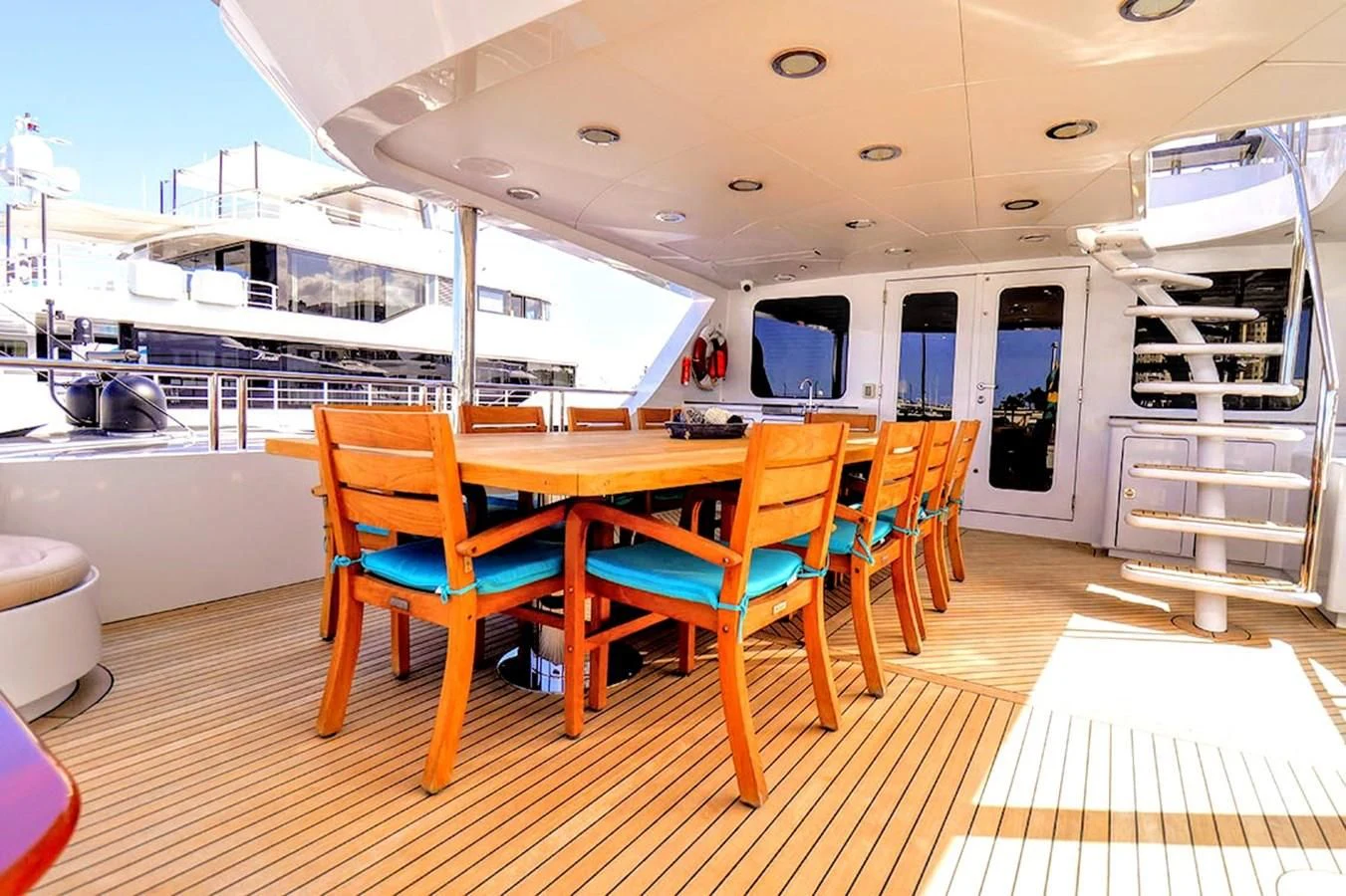 a dining table and chairs on a boat aboard JUST ENOUGH Yacht for Charter